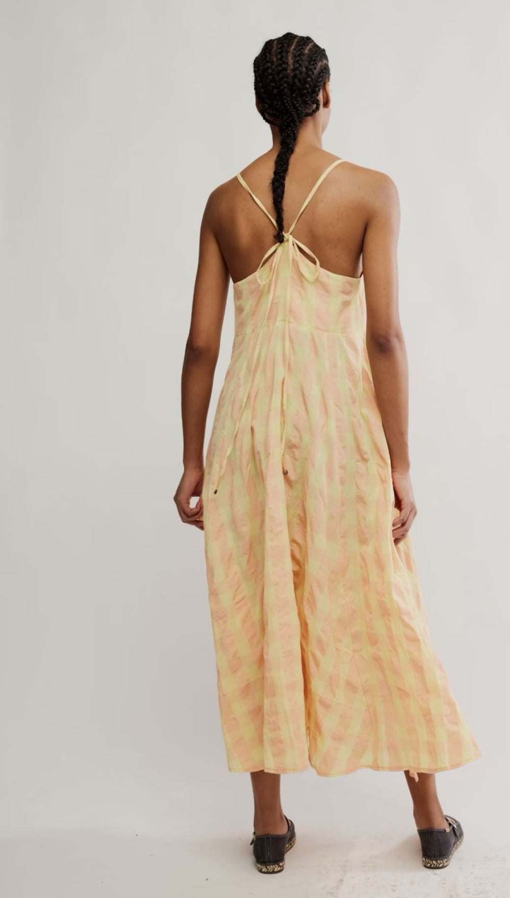 Woman in a light yellow dress.