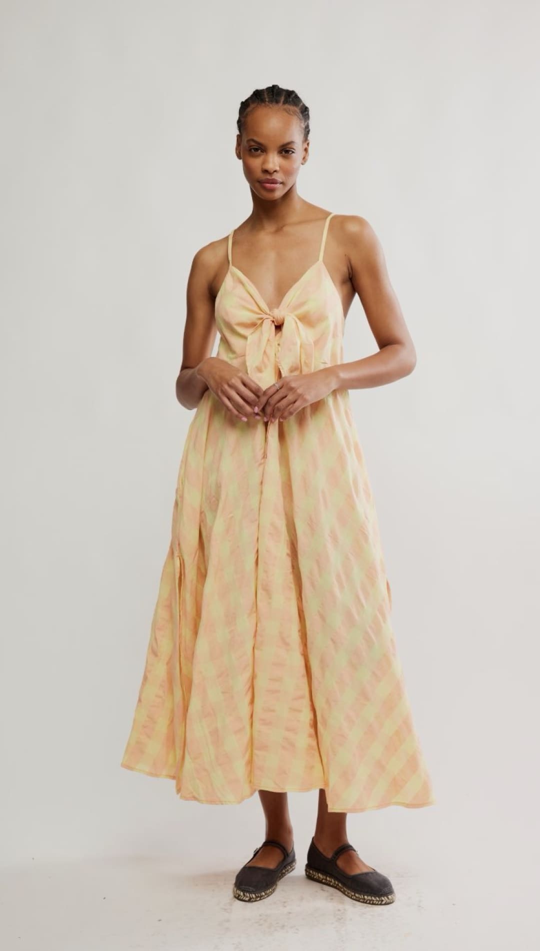 Woman in a peach-colored dress.