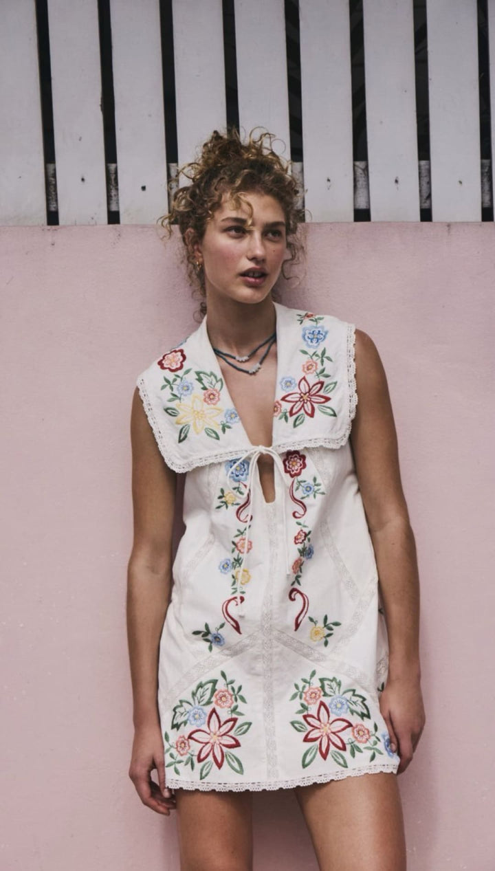 White floral embroidered mini dress.