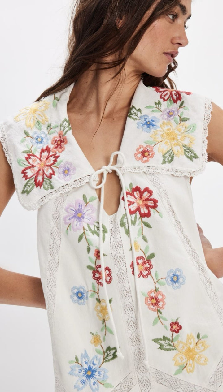 White floral embroidered dress.