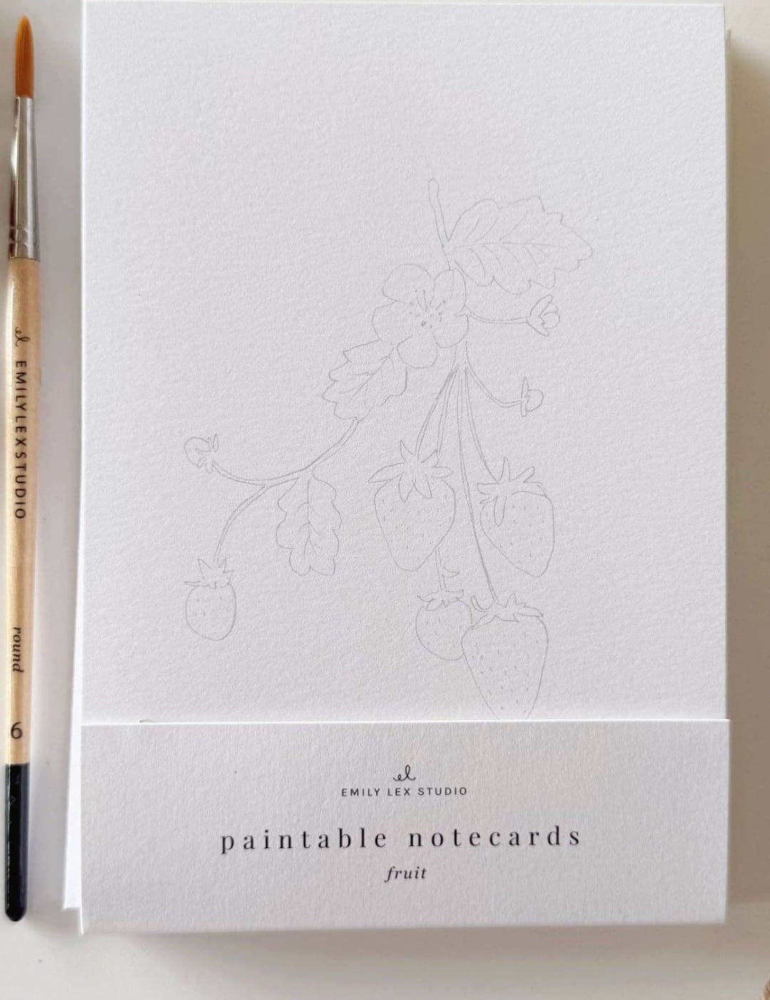 White paintable notecards with a dog design, featuring an artist’s signature and brand name.