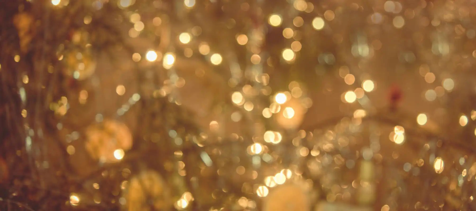 Golden bokeh lights creating a dreamy, blurred pattern.