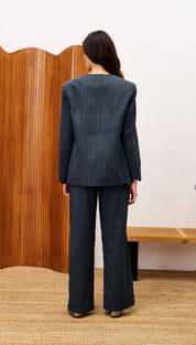 Women’s dark pinstriped pantsuit.