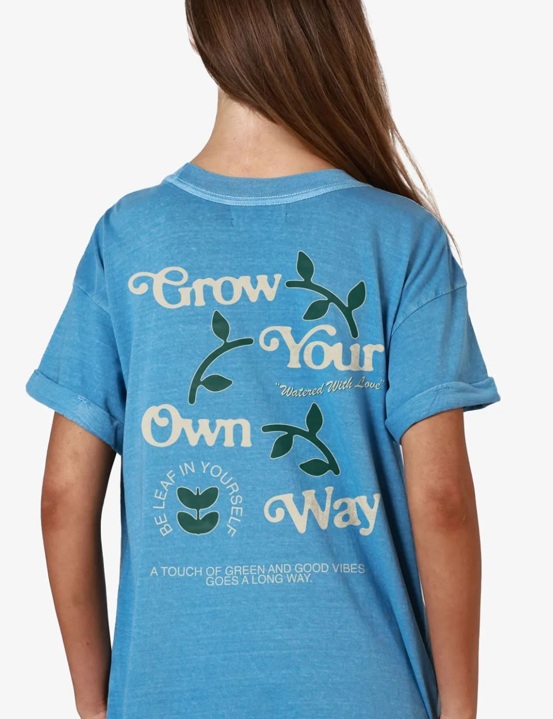 Blue t-shirt with plant-themed graphic.