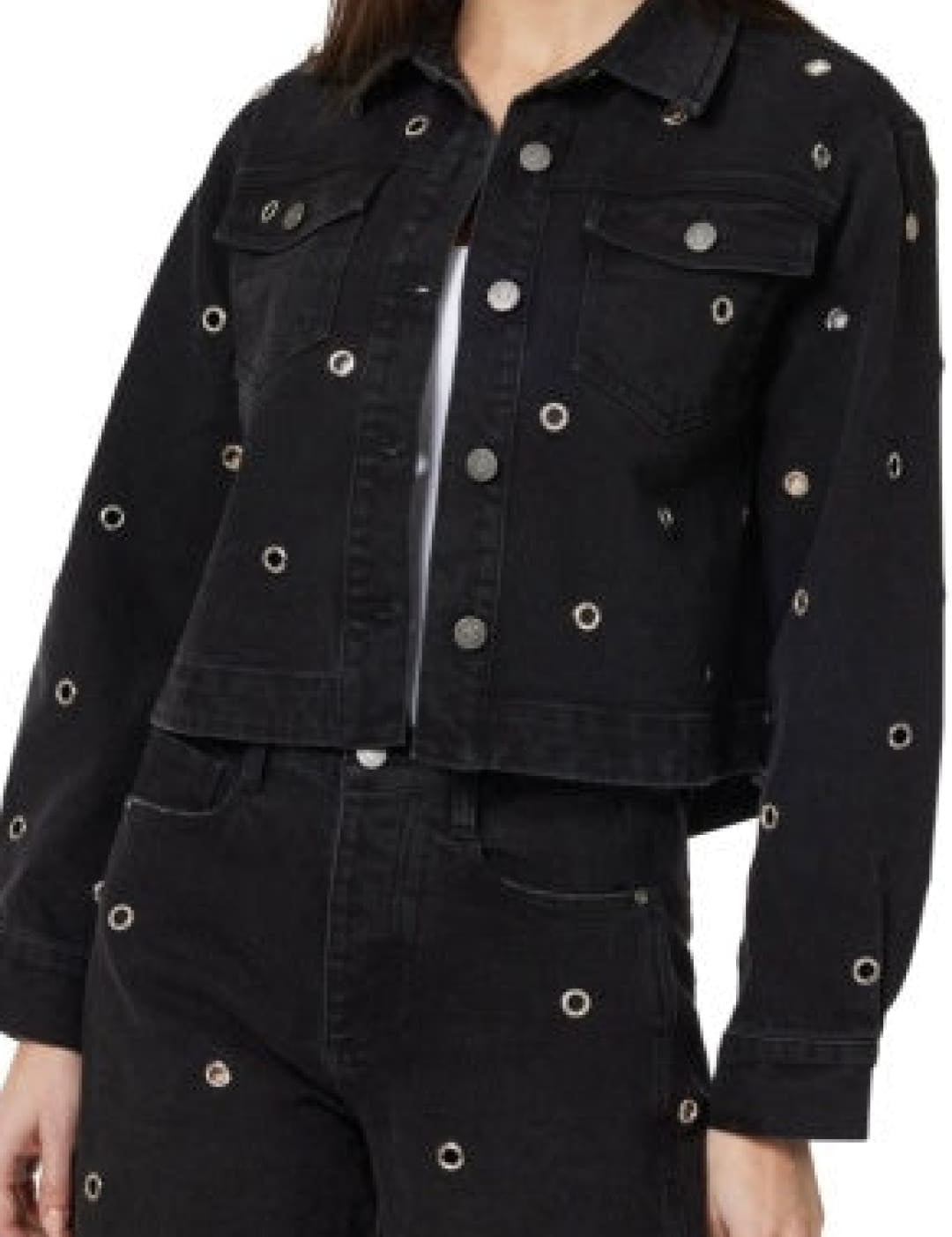Black denim jacket with silver eyelet details and zipper, possibly by levi’s.