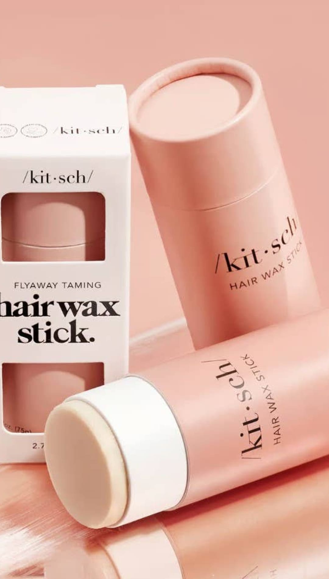 Pink hair wax stick with white cap and branding.