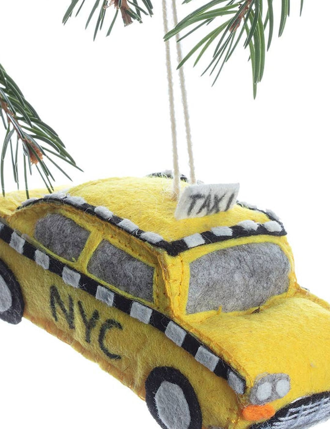 Yellow taxi cab ornament with nyc and ’taxi’ text, glitter accents.