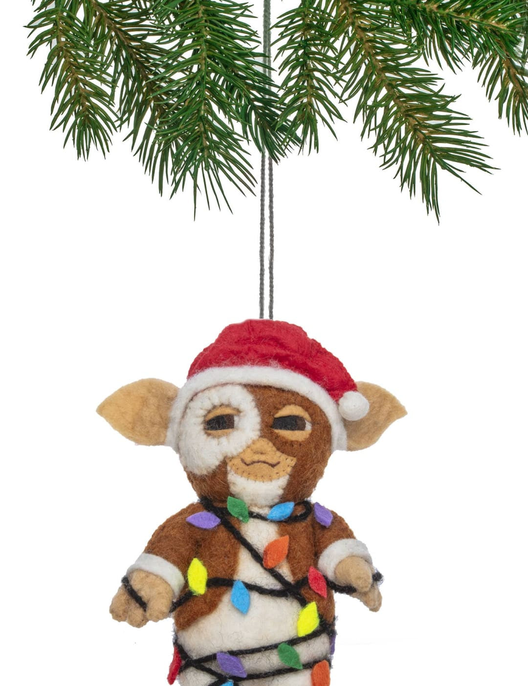 Christmas ornament featuring a gollum character from the lord of the rings, wrapped in colorful lights and wearing a santa hat.