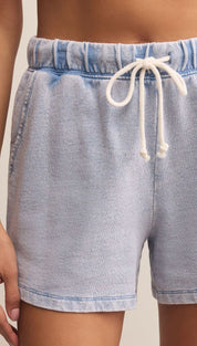Light blue denim shorts with an elastic waistband and white drawstring.
