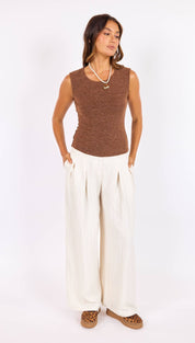 Brown textured sleeveless top with a round neckline.