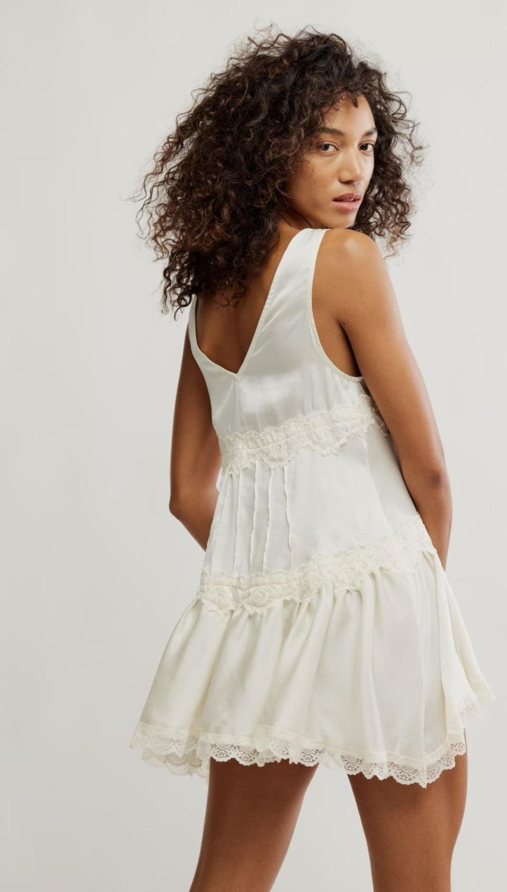 Ivory sleeveless mini dress.
