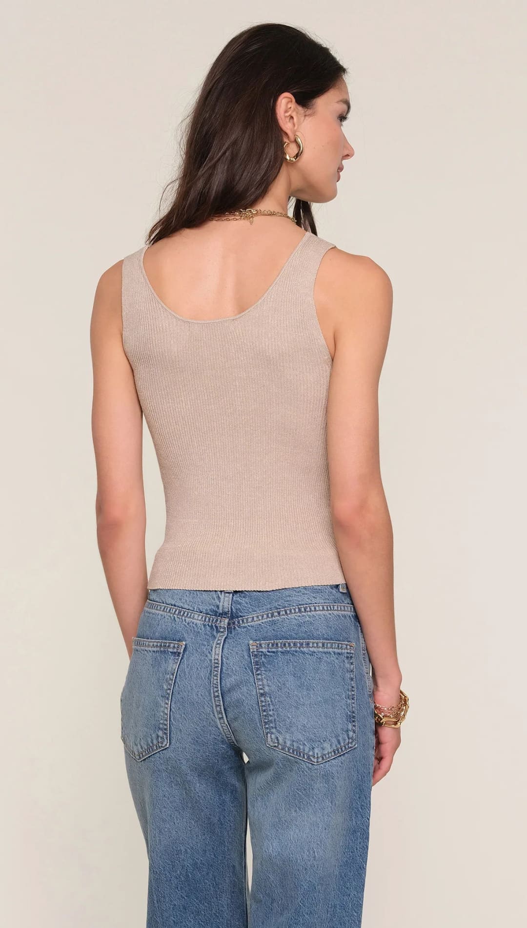 Beige tank top with scoop neckline and thin straps, likely made of cotton or polyester blend.