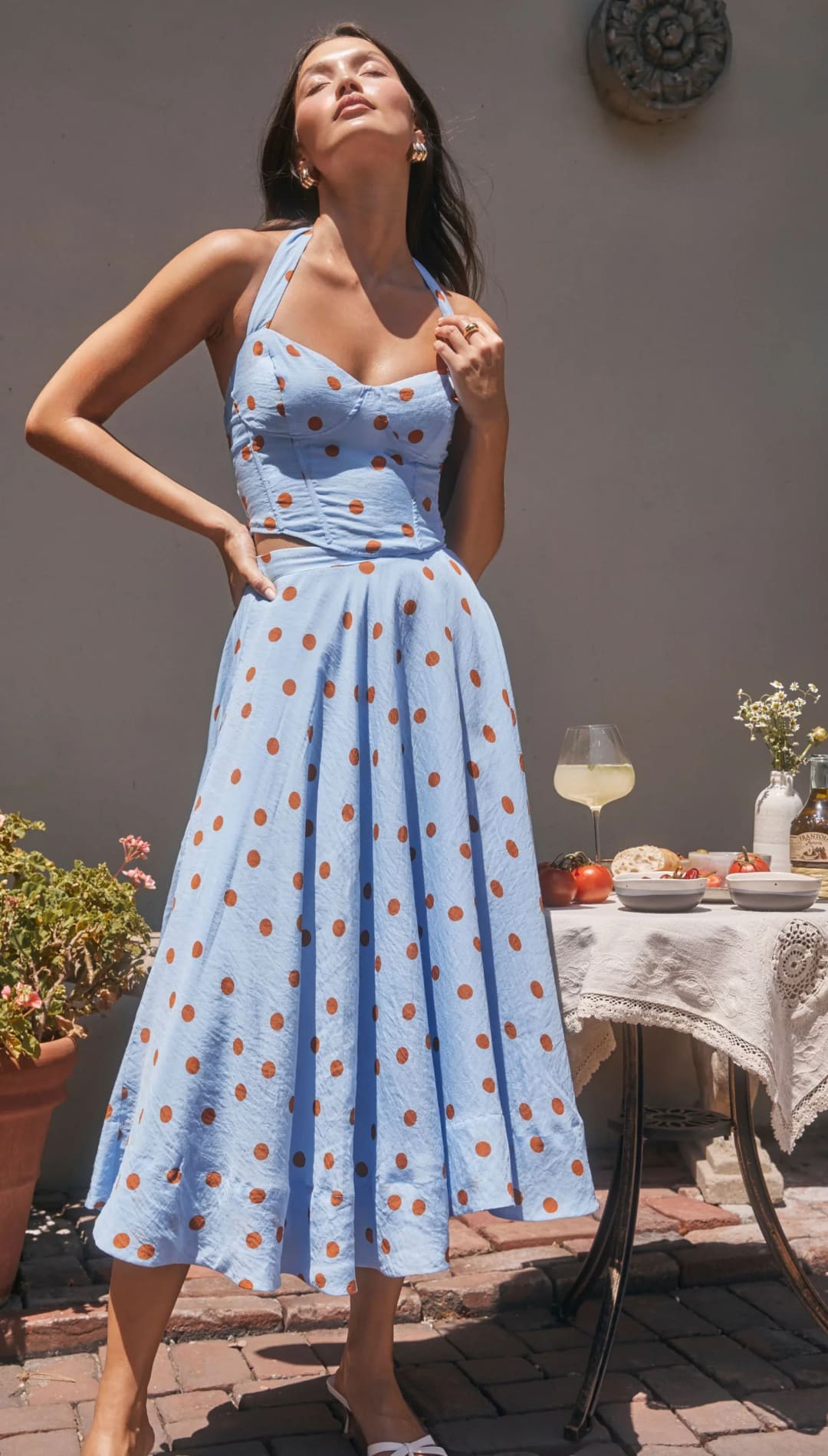 Light blue halter dress with brown polka dots.