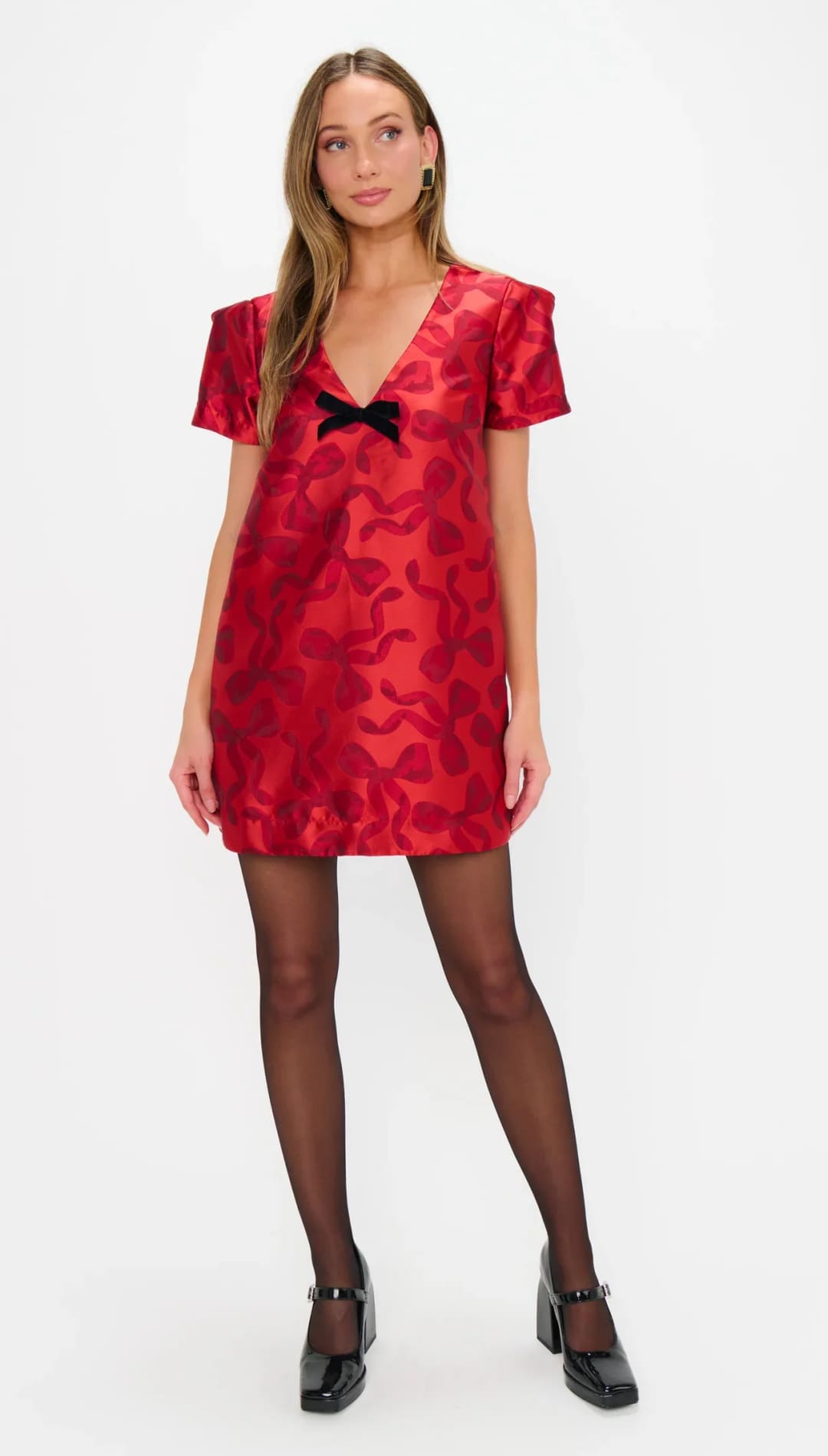 Red velvet dress with bow detail and short sleeves.