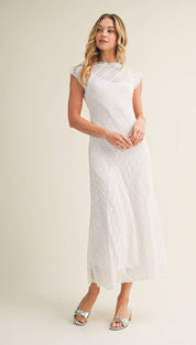 A white lace midi dress with a fitted bodice and flowing skirt.