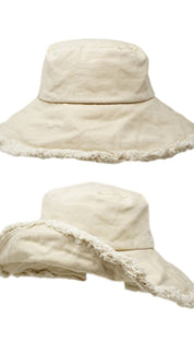 Two beige bucket hats with frayed edges.