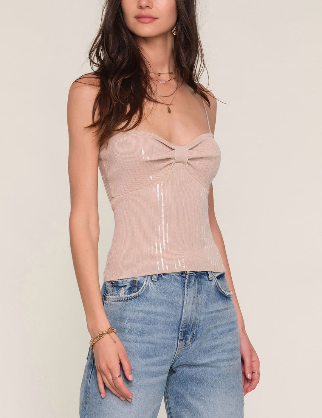 Nude bow front camisole top with sheer fabric and delicate lace detailing.