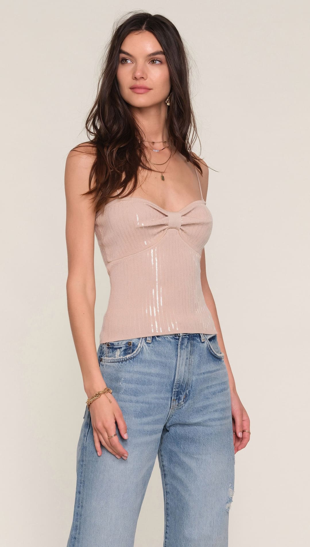 Nude bow front camisole top with sheer fabric and delicate lace detailing.