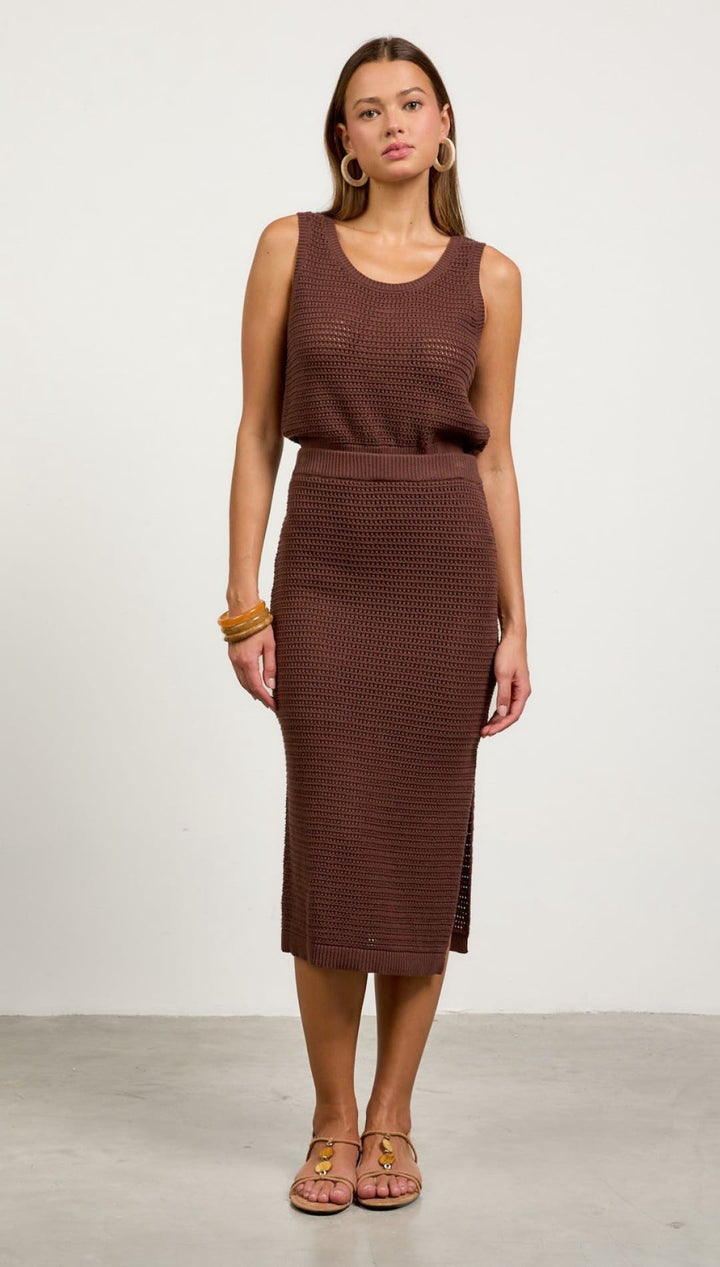 Sleeveless brown knit midi dress with a fitted skirt and relaxed tank-style top.