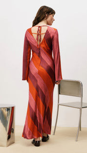 Red and orange striped dress with long sleeves, back cutout detail.