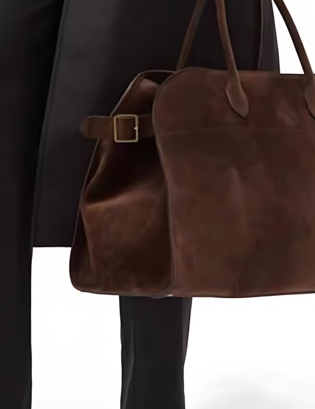 Brown leather tote bag with buckle detail and long handles.