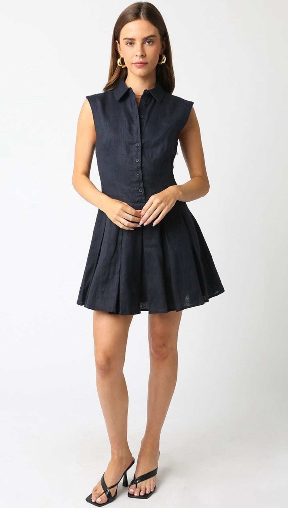 Sleeveless navy shirt dress.