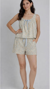 A soft, light green floral print two-piece loungewear set with a square neckline and matching shorts.