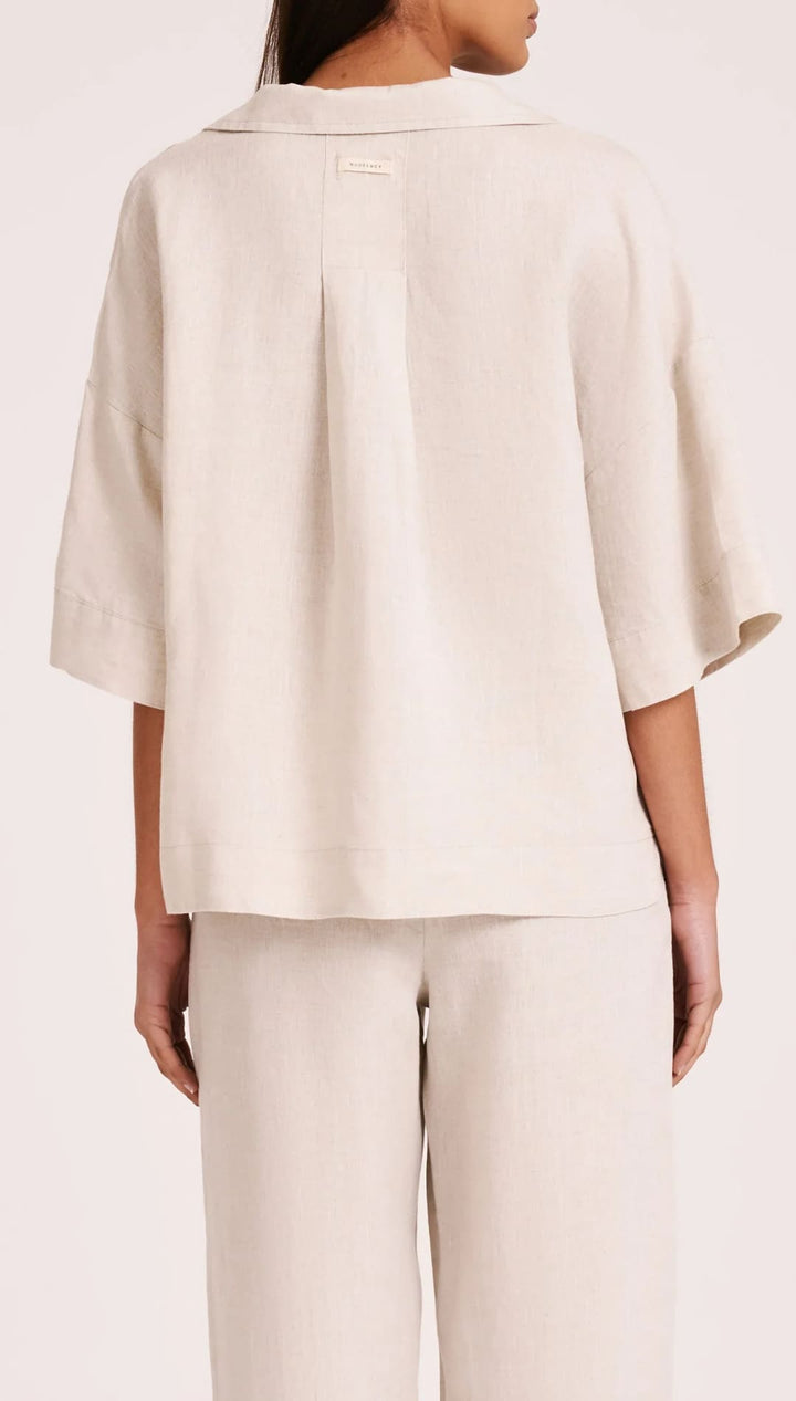 Beige linen shirt and pants set.