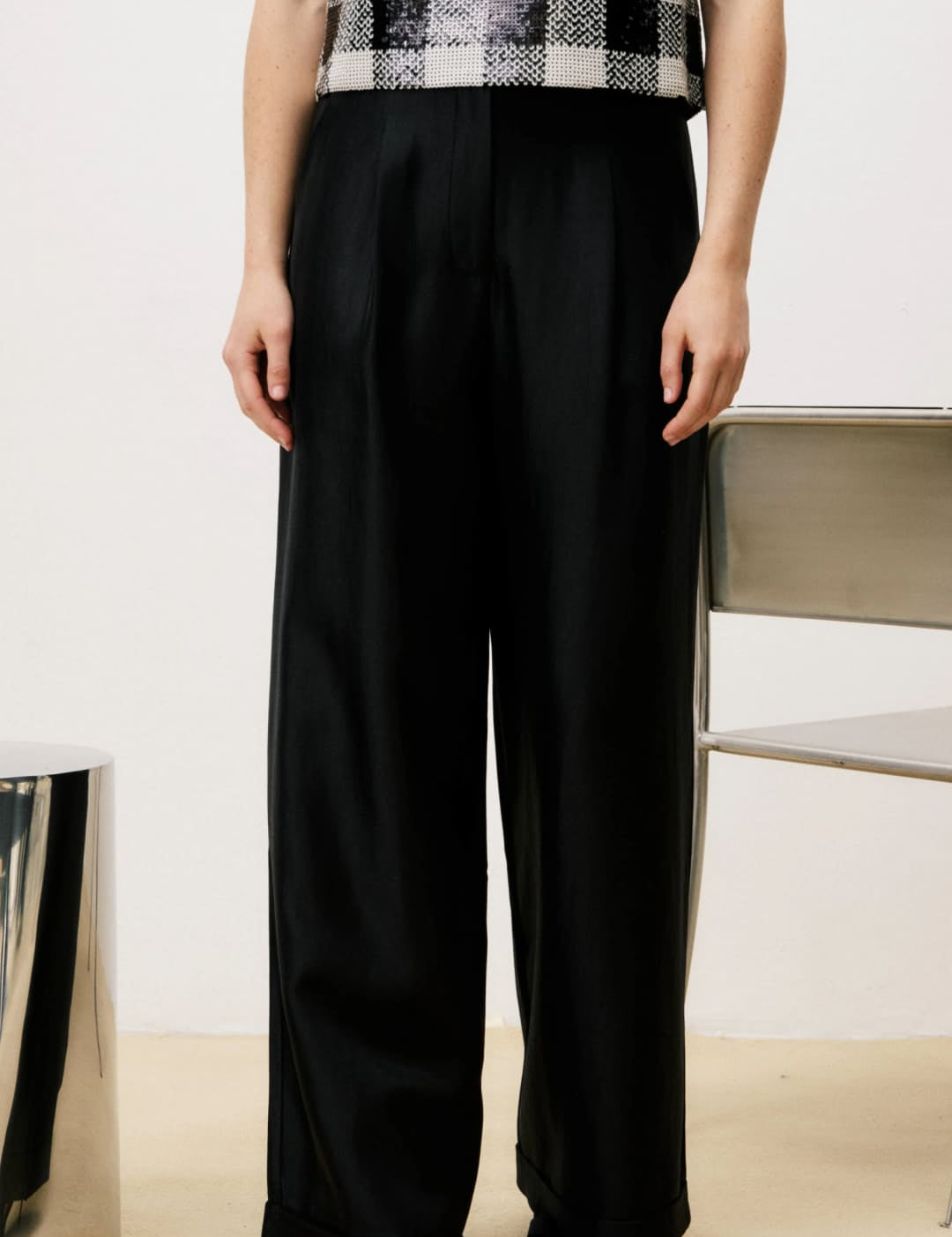Black wide-leg pants with a high waist and straight leg design.