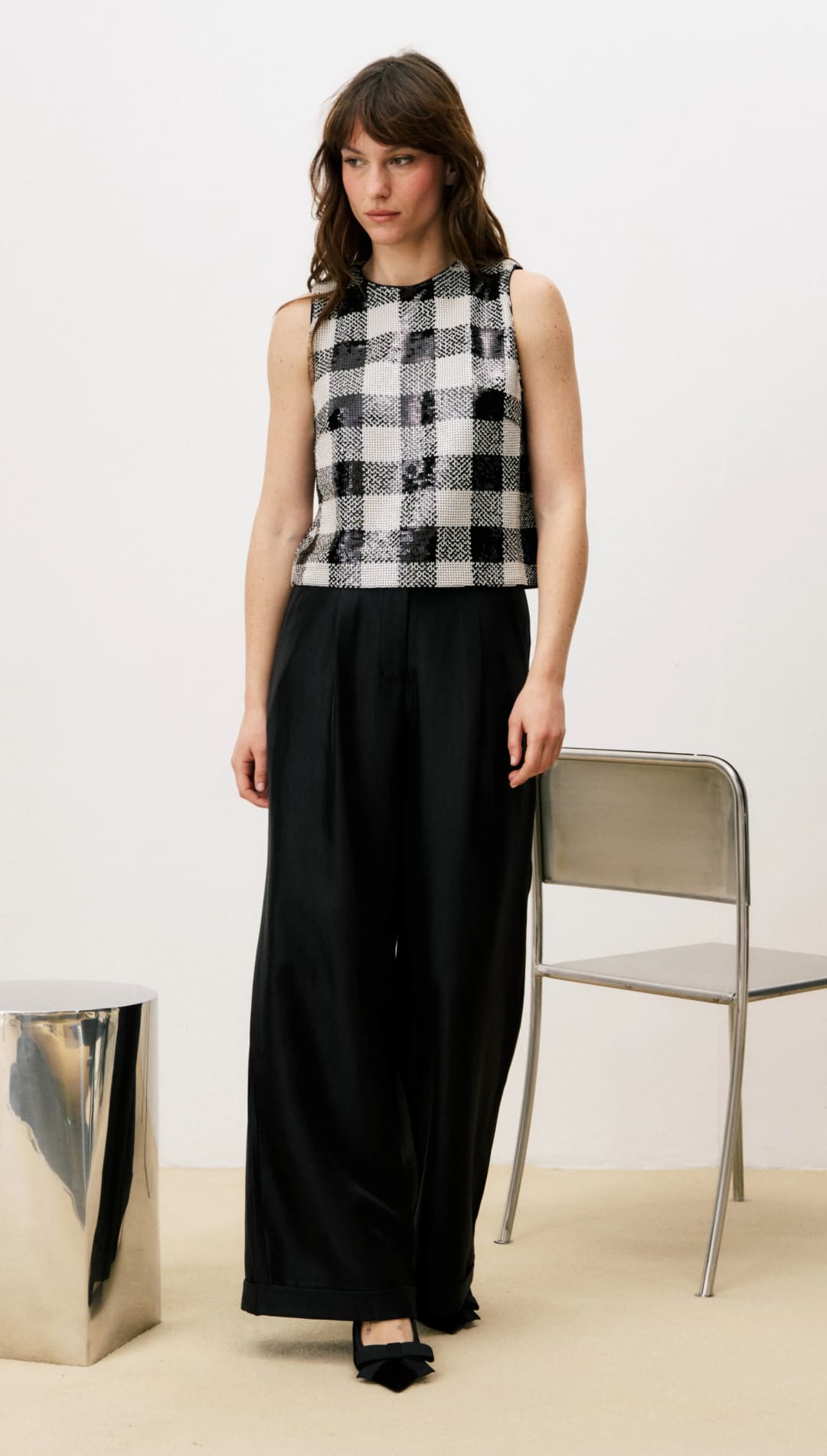 Black and white plaid sleeveless top with wide-leg pants.