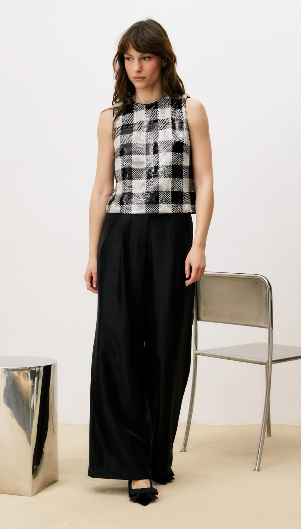 Black and white plaid sleeveless top with wide-leg pants.