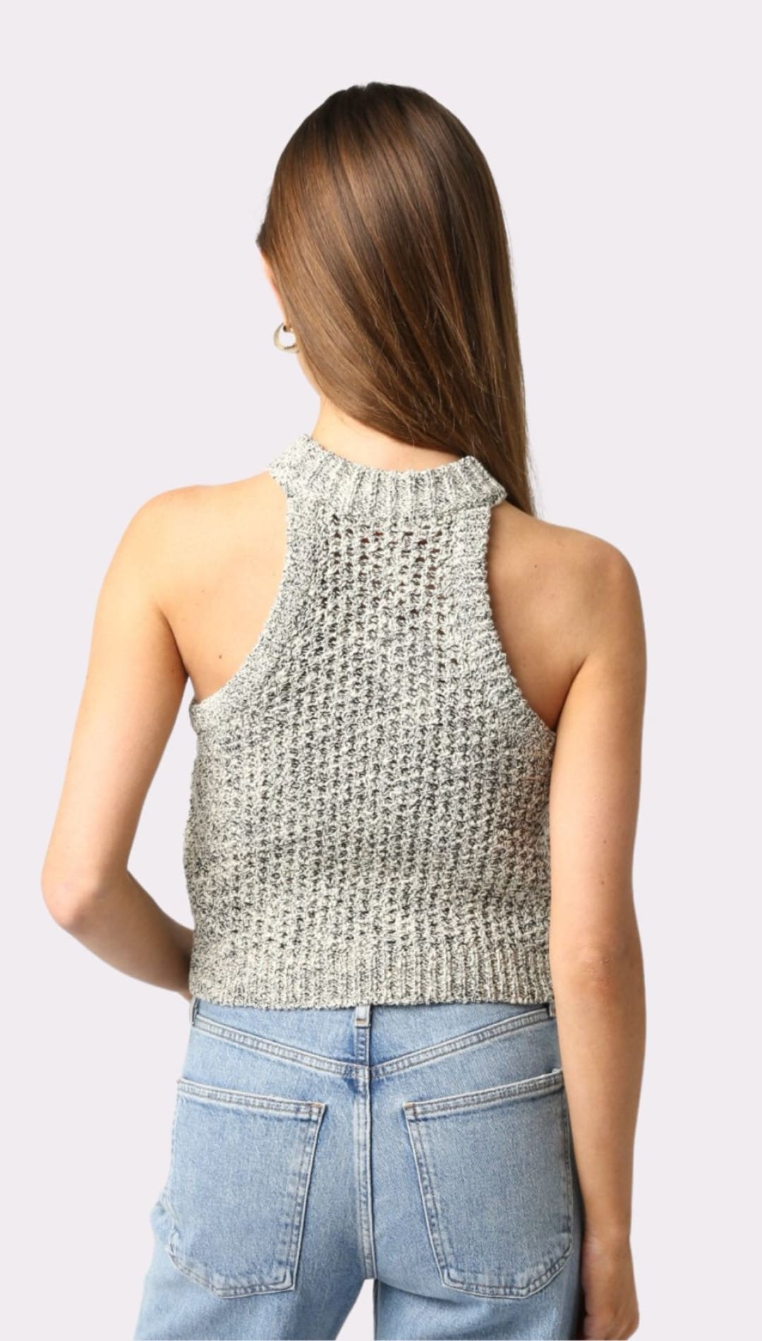 Woman’s knit halter top and jeans.