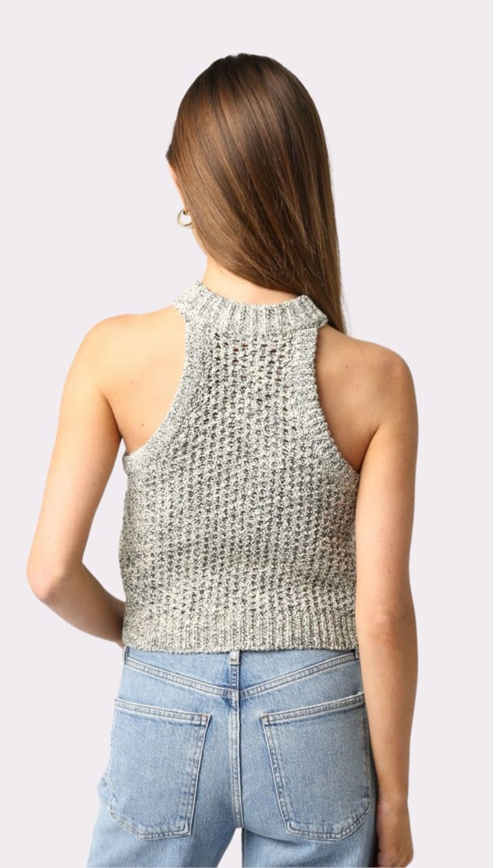 Woman’s knit halter top and jeans.