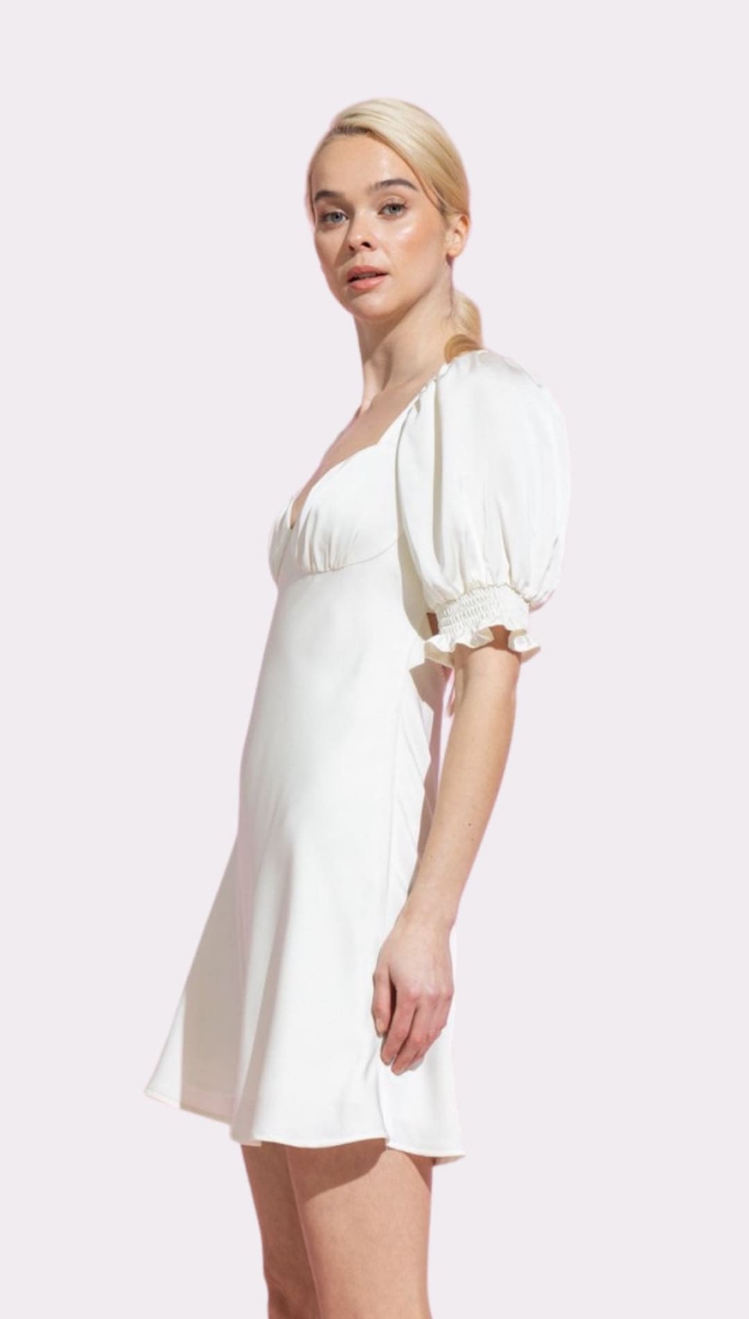 White puff-sleeved mini dress.
