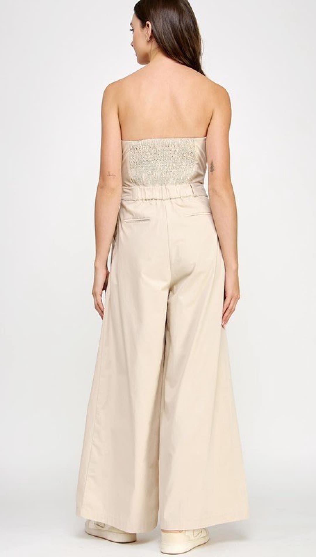 Beige strapless jumpsuit.