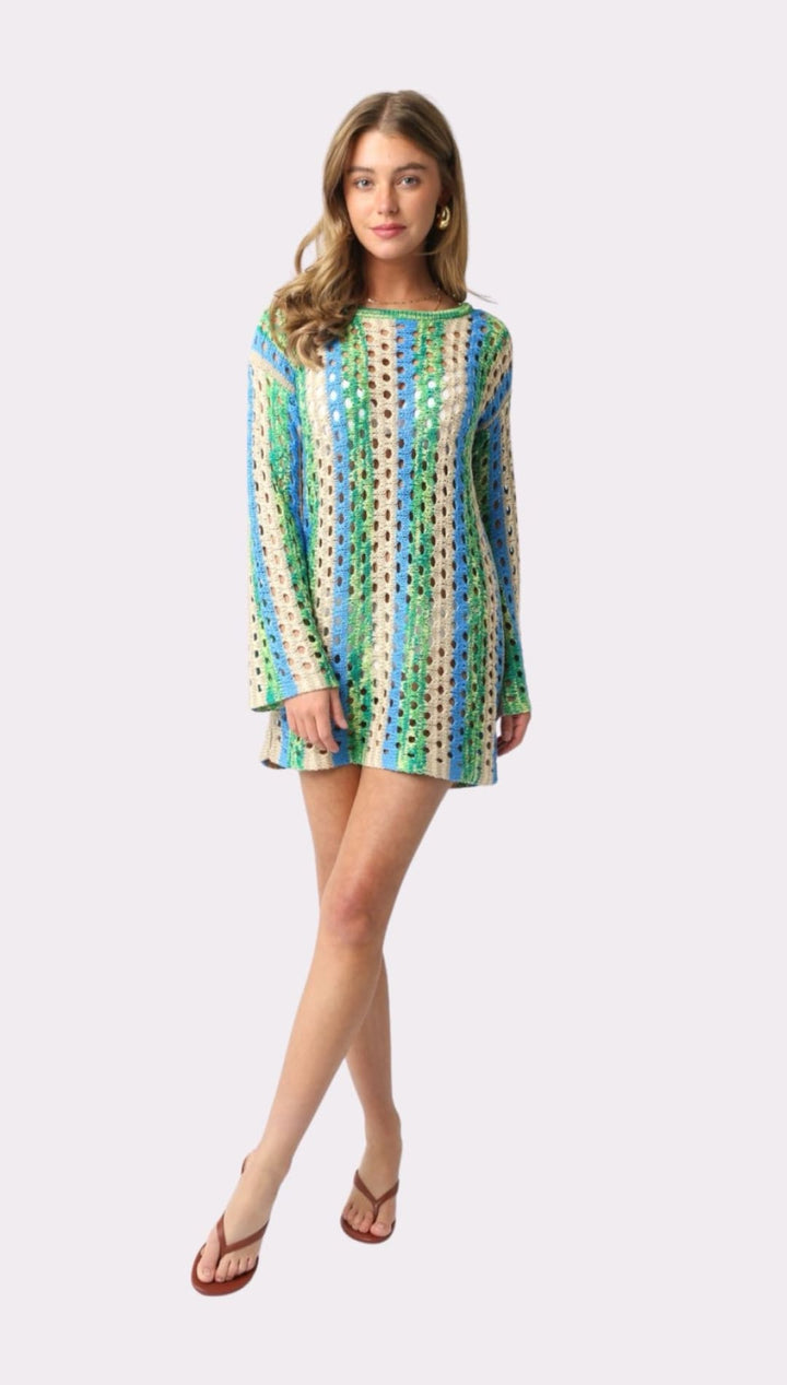 Crocheted mini dress with long sleeves.