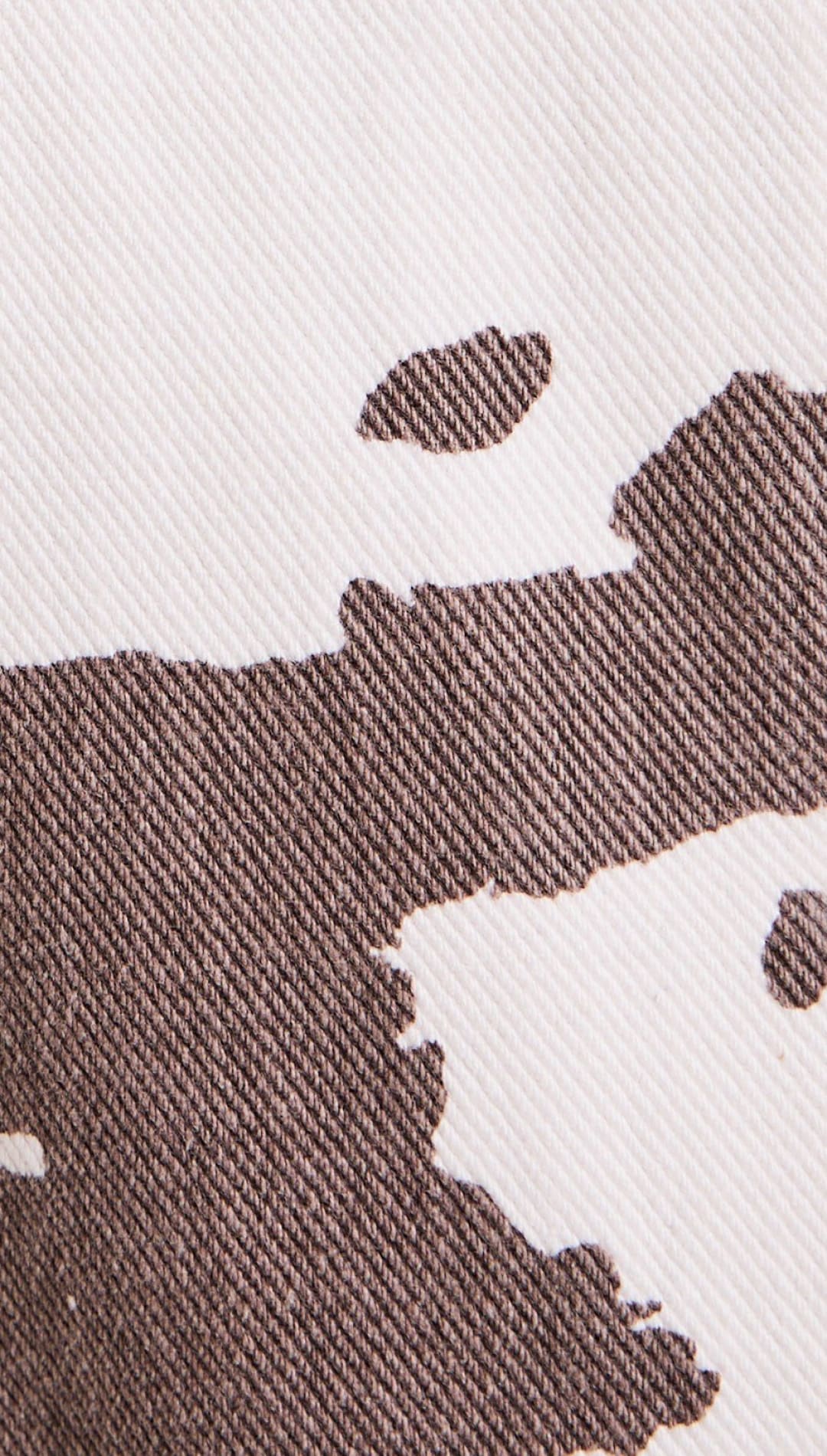 Brown and white cow-print denim.