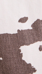 Brown and white cow-print denim.