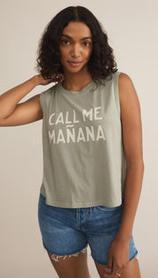 Woman wearing a sleeveless shirt and denim shorts.