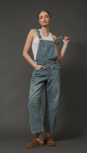 Denim overalls with paperbag waist and patch pockets, brown suede moccasins.