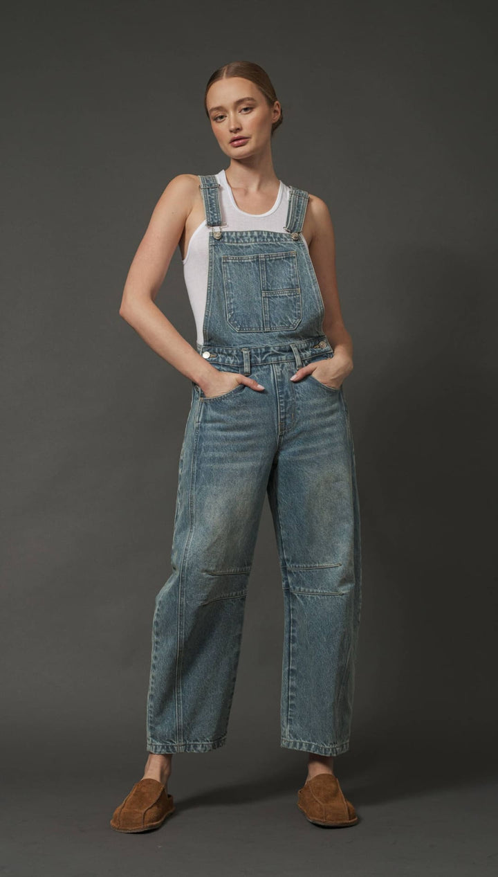 Denim overalls with paperbag waist and patch pockets, light blue wash.