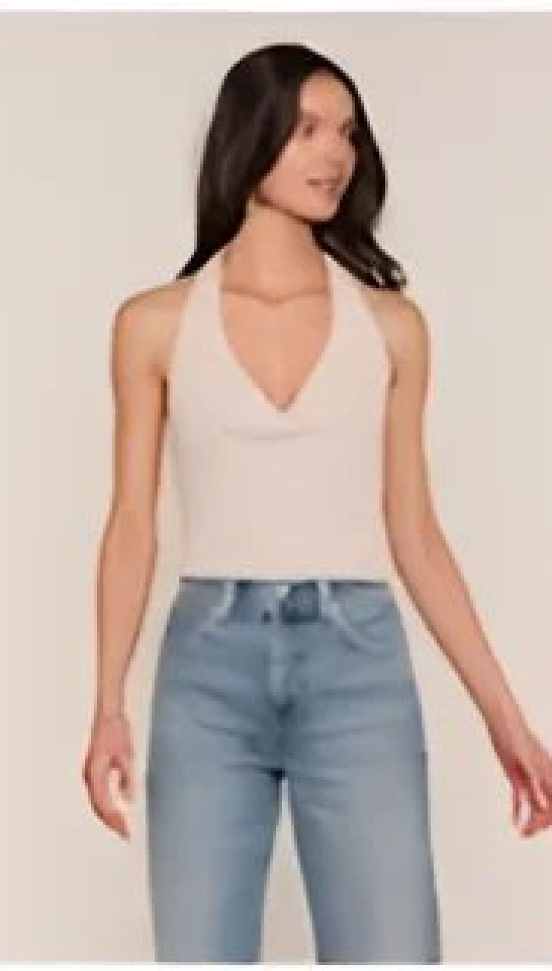 Beige sleeveless top with a v-neck and thin straps.