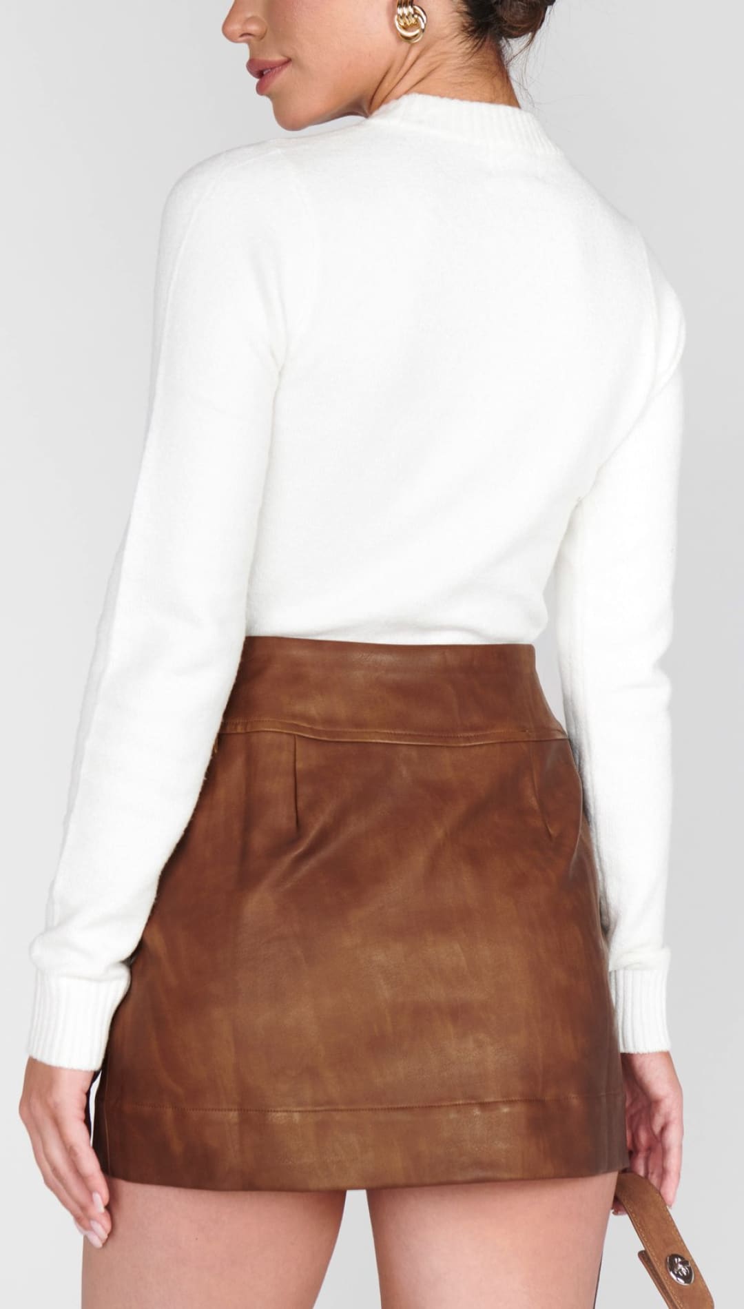 Brown leather mini skirt.