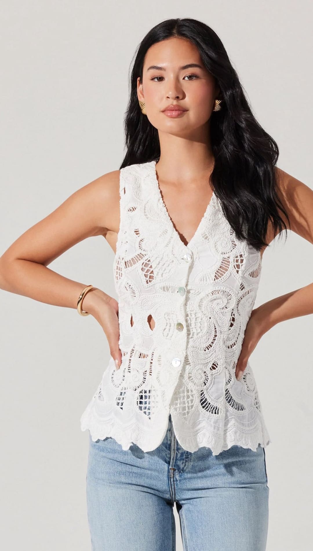 White lace button-up vest.