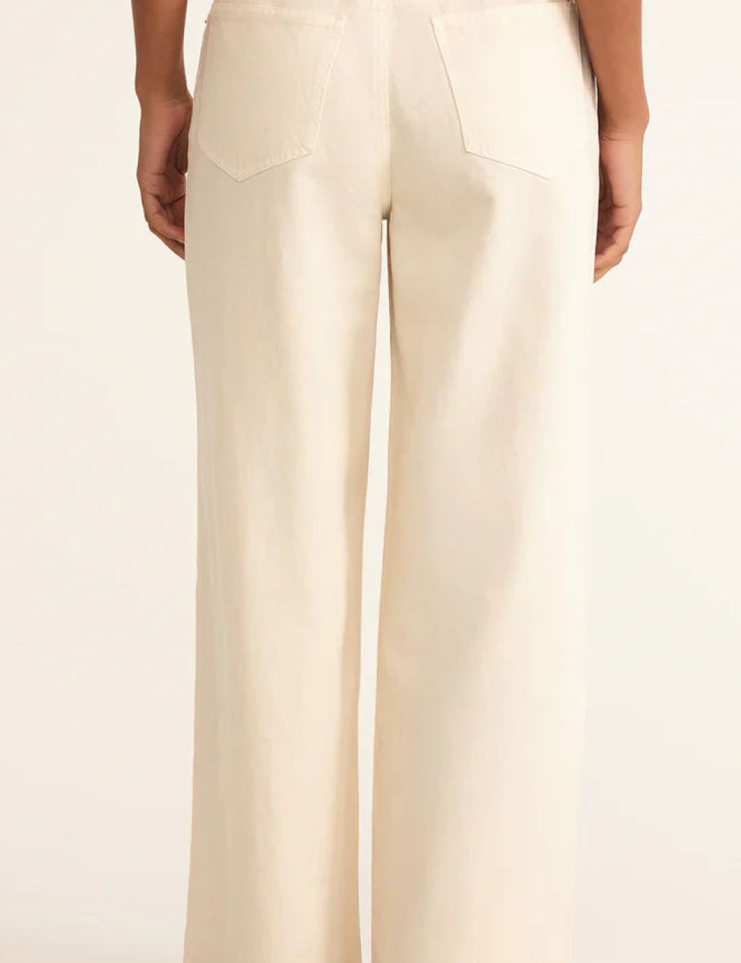 Cream-colored wide-leg pants with a high waist and structured design.