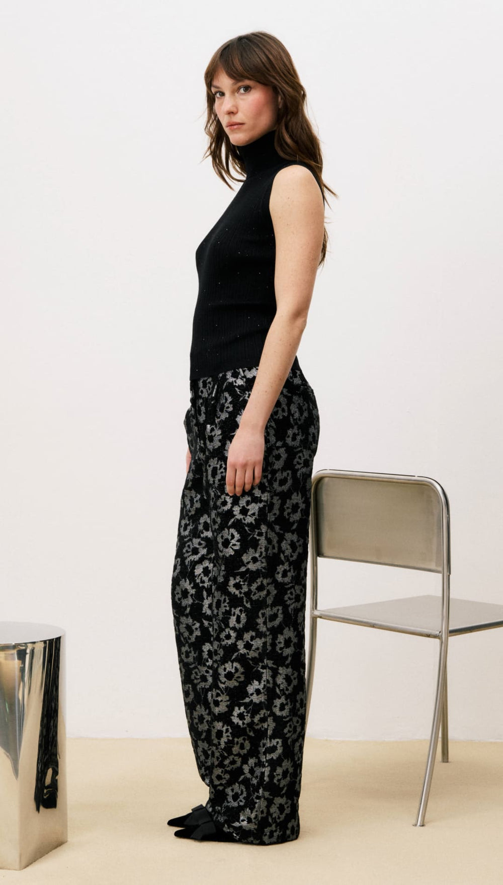 Black floral print wide-leg pants with a high waist and elastic hem.