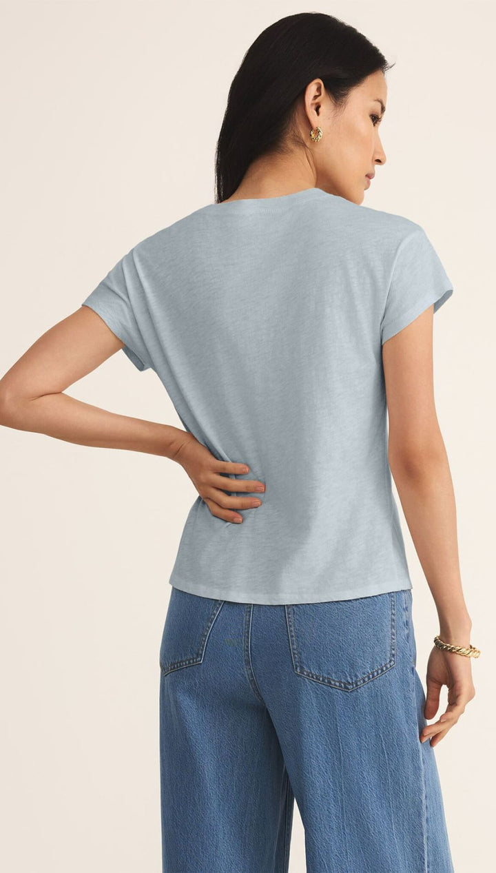 Light blue t-shirt.