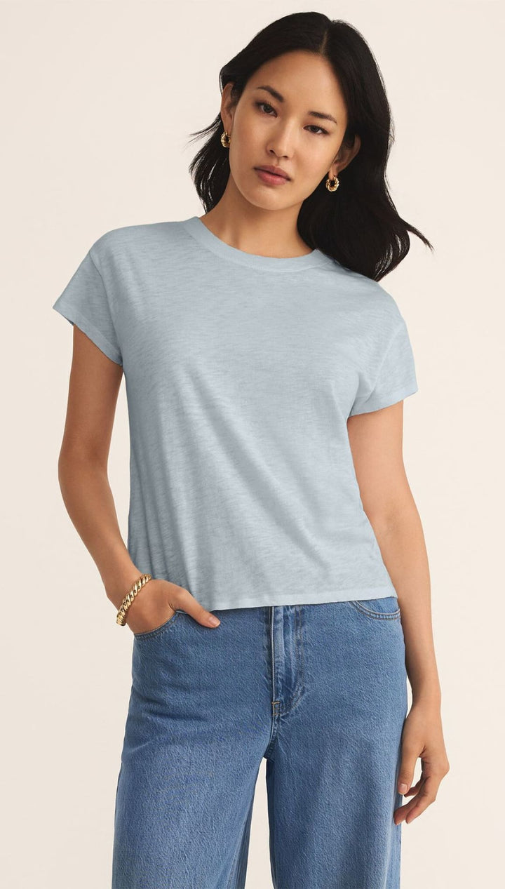 Light blue t-shirt.