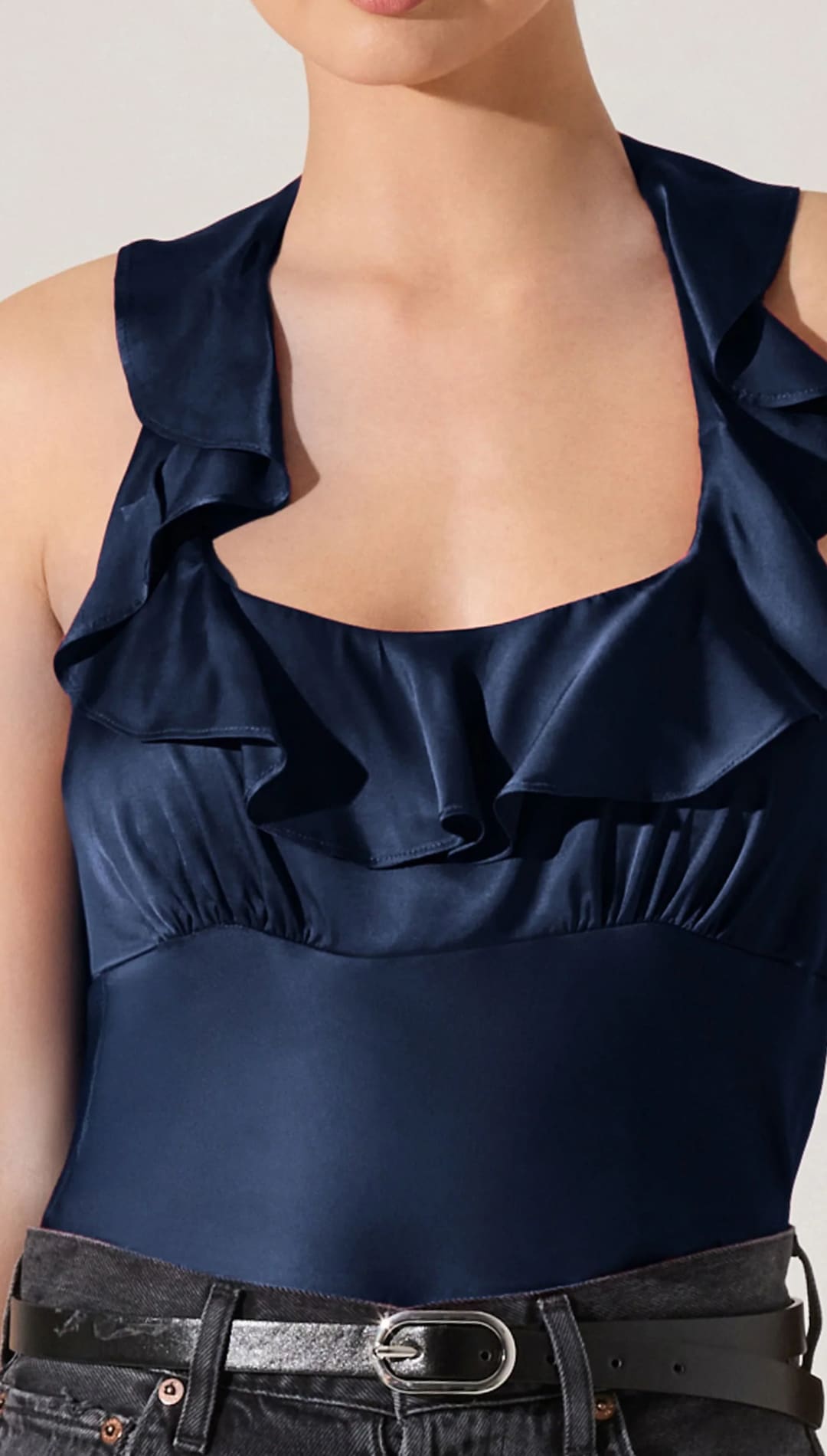 A women’s navy blue ruffled halter neck top.