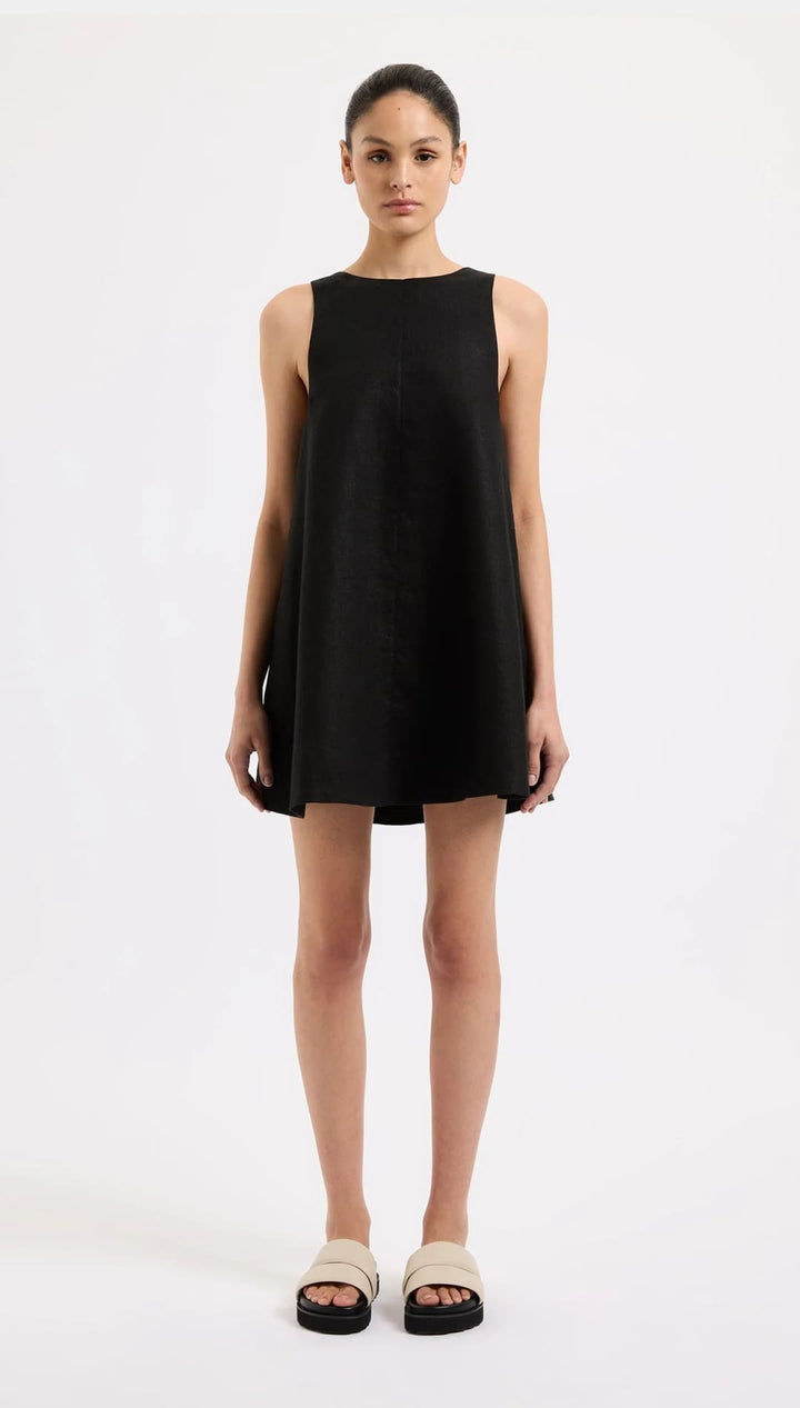 Sleeveless black mini dress.